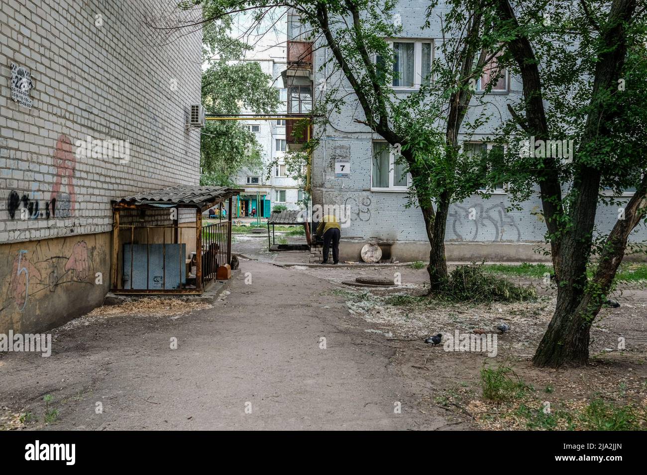 Severodonetsk, Ukraine. 25th May, 2022. People living in a bunker seen cooking food outside. Severodonetsk, the largest city under Ukrainian control in Luhansk province, has come under intense artillery and missile strikes from Russian army. The city is almost completely isolated from the rest of the region. Credit: SOPA Images Limited/Alamy Live News Stock Photo