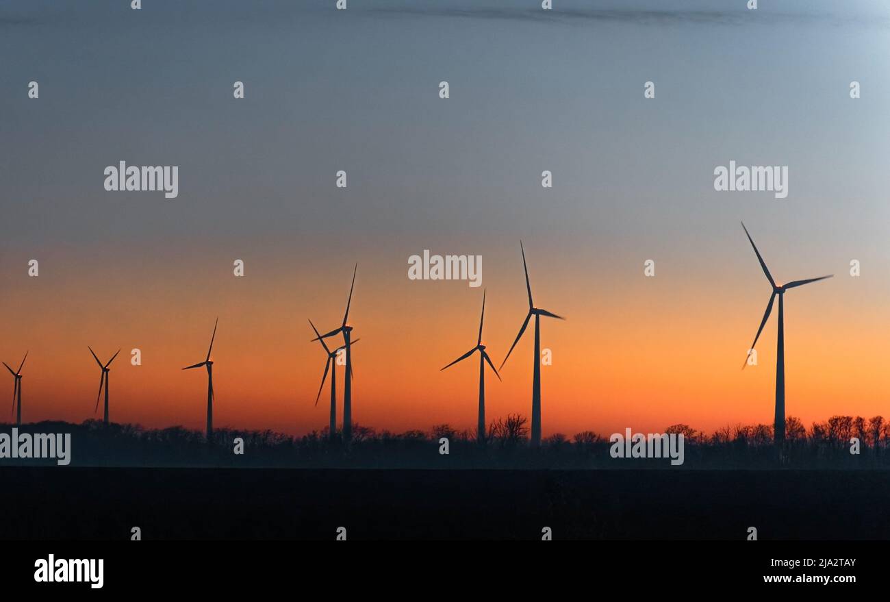 Wind Turbines In Rural Landscape At Sunset. Green renewable and ...