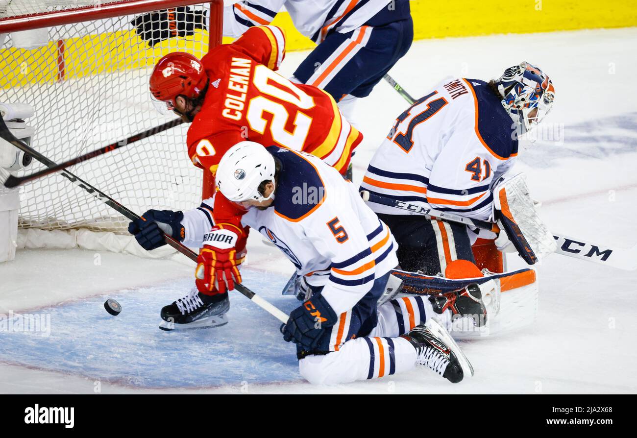 Edmonton Oilers Edmonton Oilers, centre, checks Calgary Flames forward