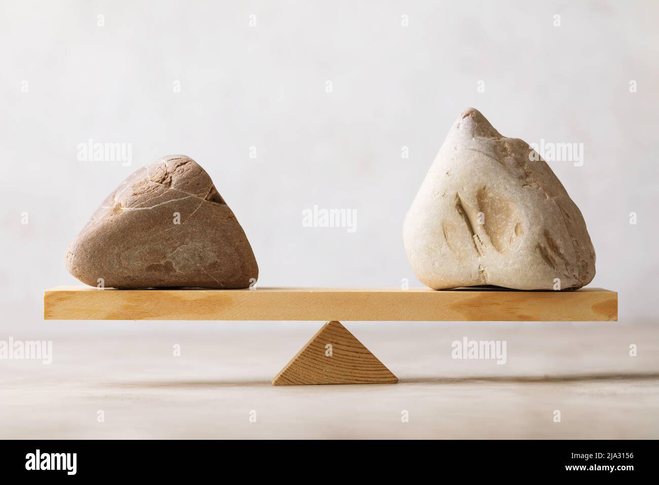 Balancing stones on scales, template for designers Stock Photo Alamy