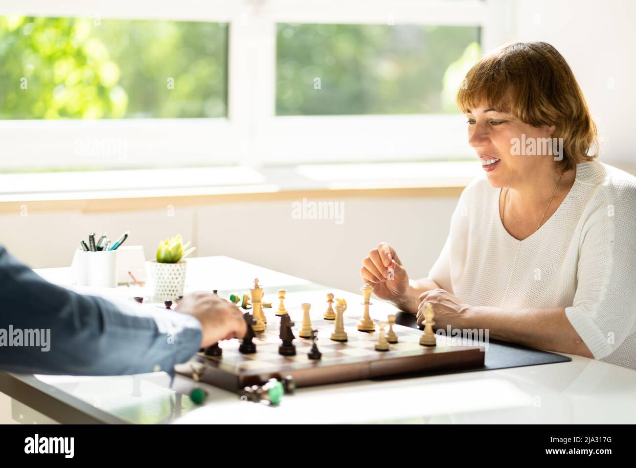 Elderly Senior Playing Chess Table Board Game Stock Photo