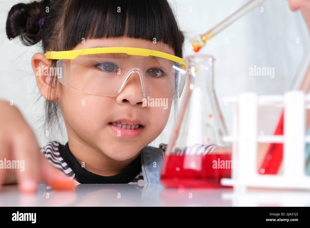Children are learning and doing science experiments in the classroom