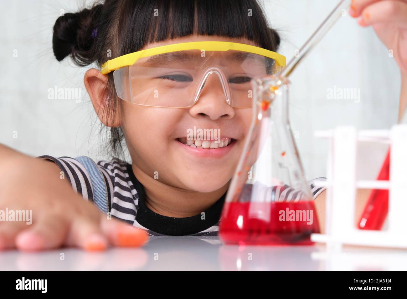 Children are learning and doing science experiments in the classroom