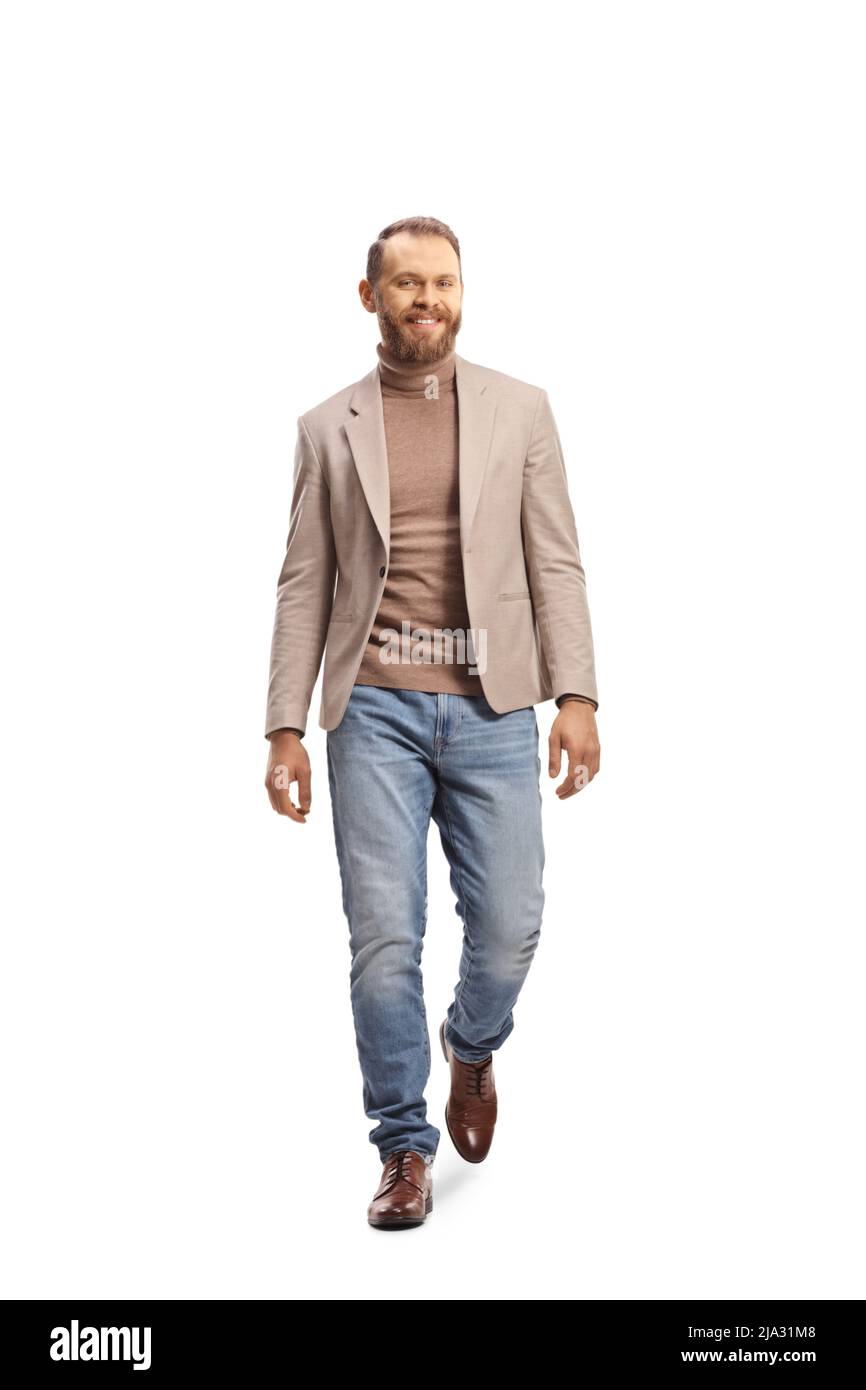 Fair haired young man walking towards camera and smiling isolated on ...
