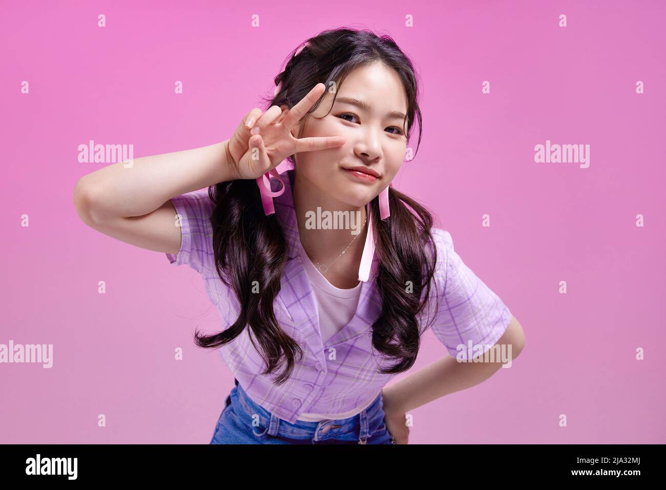 mz generation, cute Asian Korean girl with v shaped finger pose Stock Photo  - Alamy