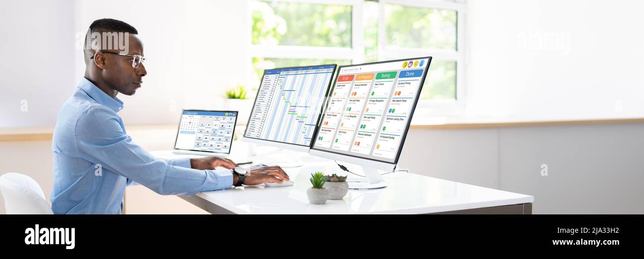 Gantt Chart Calendar Schedule On Multiple Computers Stock Photo
