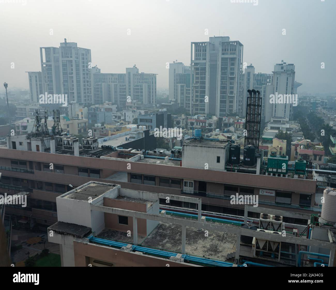 A cityscape morning view at Baani Square shows very poor visibility due to increased air pollution. Stock Photo