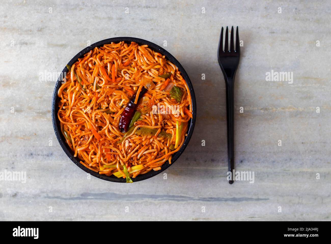 Delicious Chinese food Hakka Noodles is ready to eat. Stock Photo