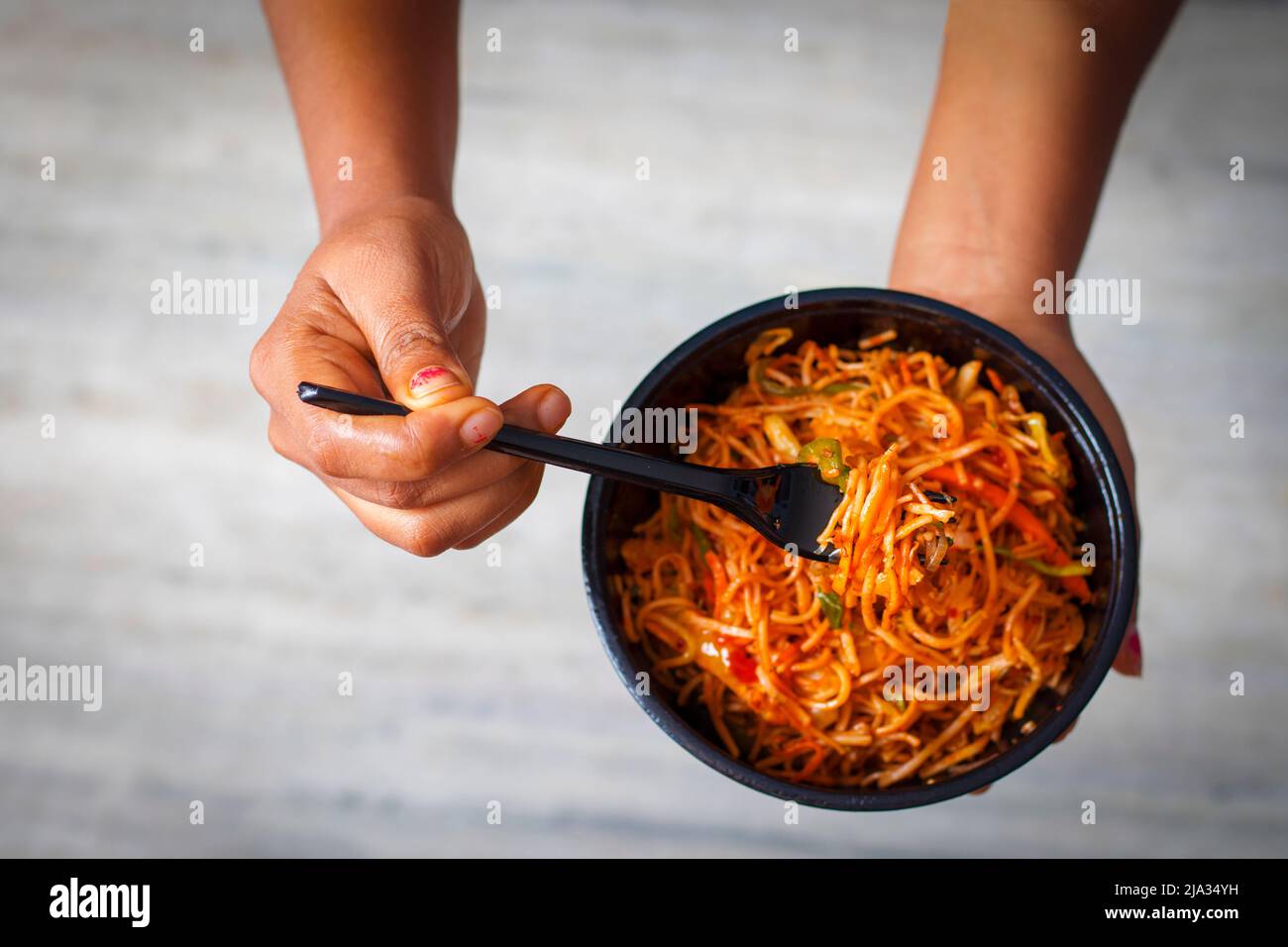 Delicious Chinese food Hakka Noodles is ready to eat. Stock Photo