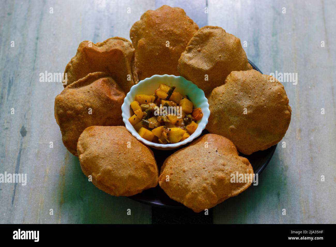 popular food in south Asian countries like India,Pakistan,Bangladesh 'puri' made of millet flour. Stock Photo