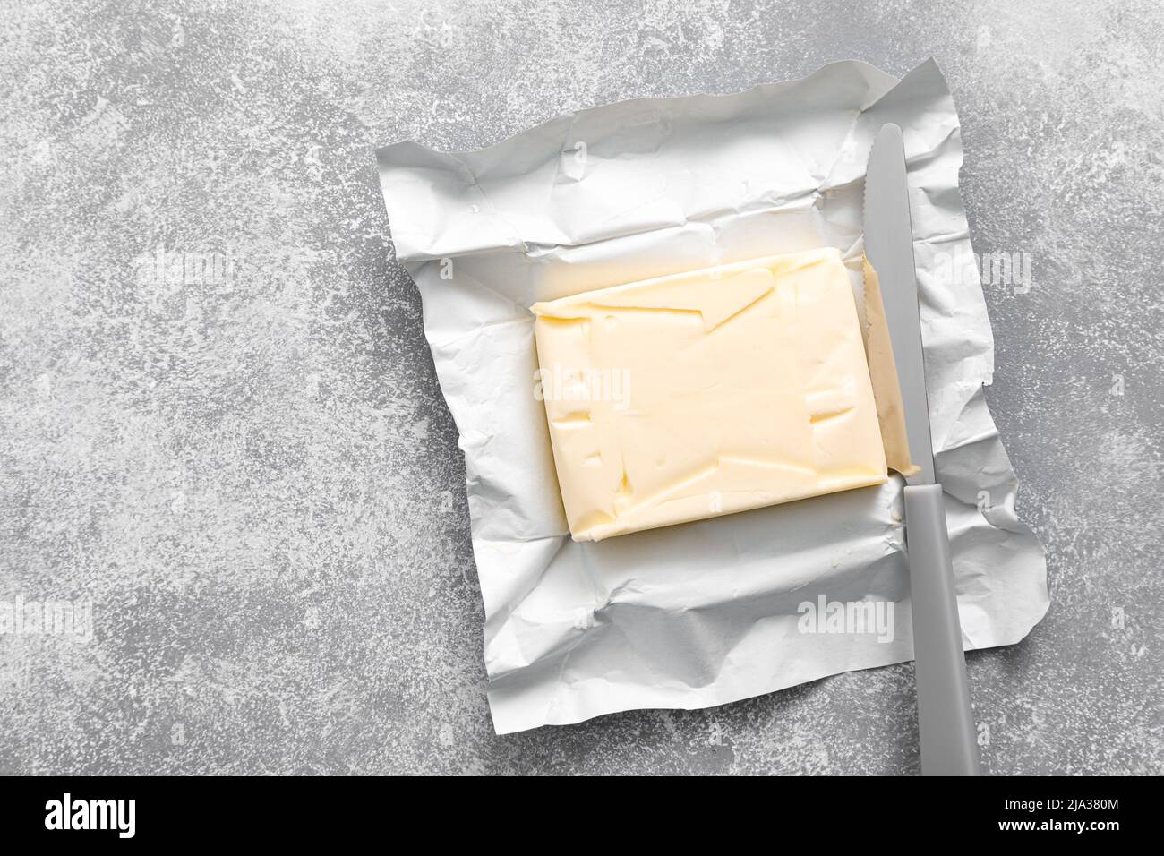 Block of butter with butter knife in a open pack Stock Photo Alamy