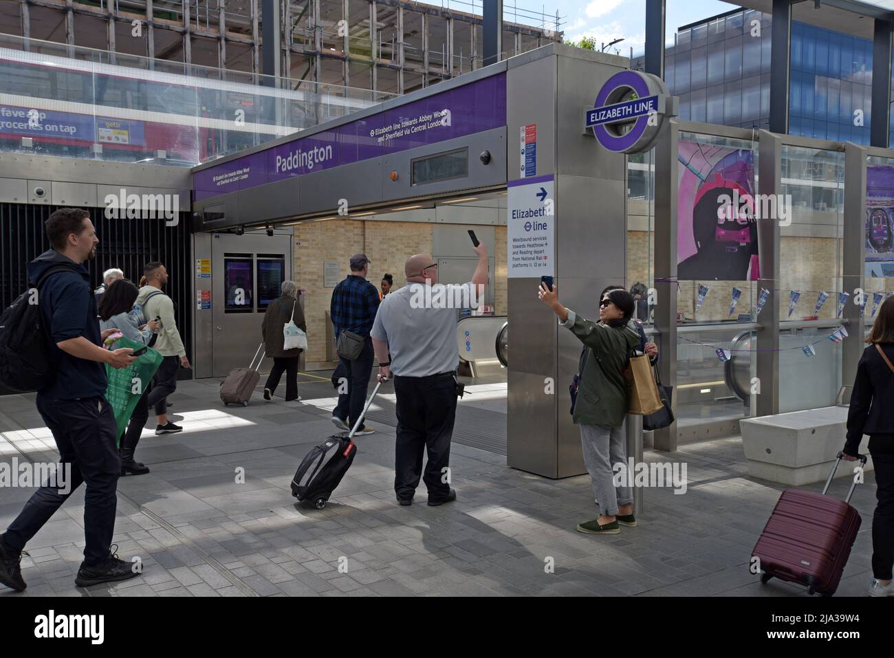 Passengers taking photos and selfies at Paddington Elizabeth Line Station on the opening day of the new Crossrail service - Stock Image