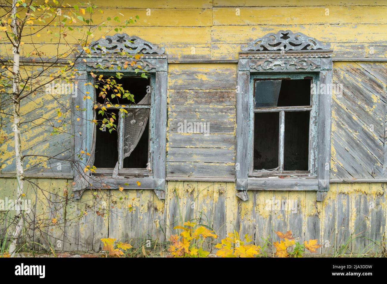 Carved wooden windows in old wooden houses in Oleshnia village, Chernihiv region, Ukraine. Ukrainian culture heritage Stock Photo