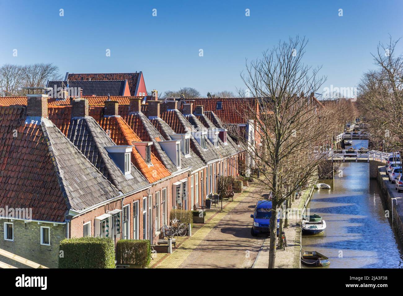 Row of old houses at the canal of Harlingen, Netherlands Stock Photo