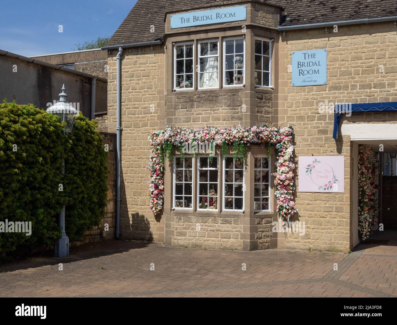 The flower decked frontage of the Bridal Room, a wedding dress shop in