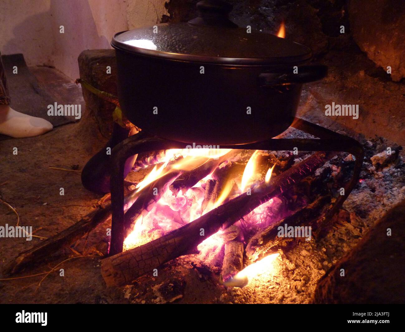 pot with food on the local fire stove Stock Photo Alamy
