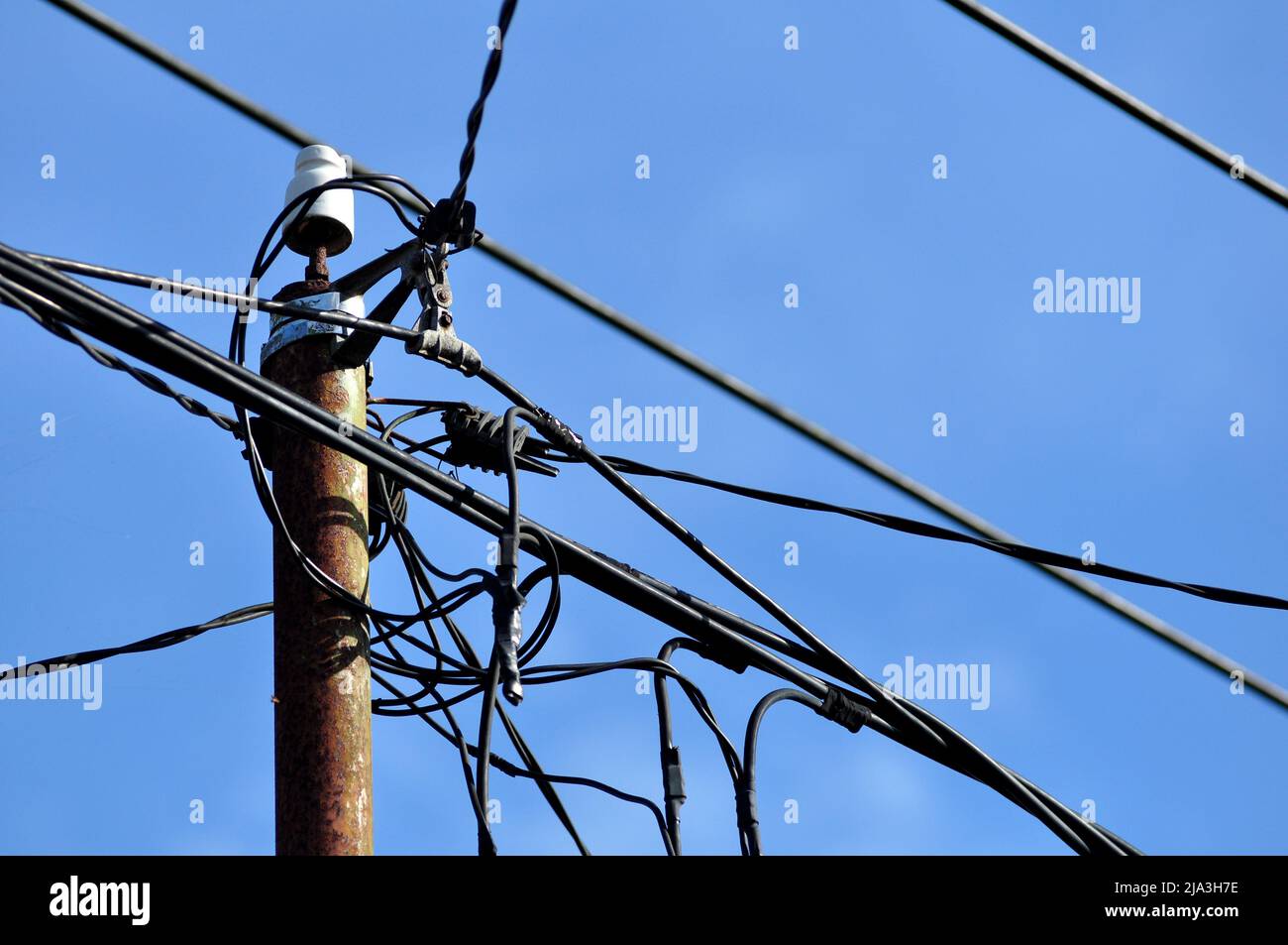 Electric cables and poles in residential in Indonesia Stock Photo Alamy