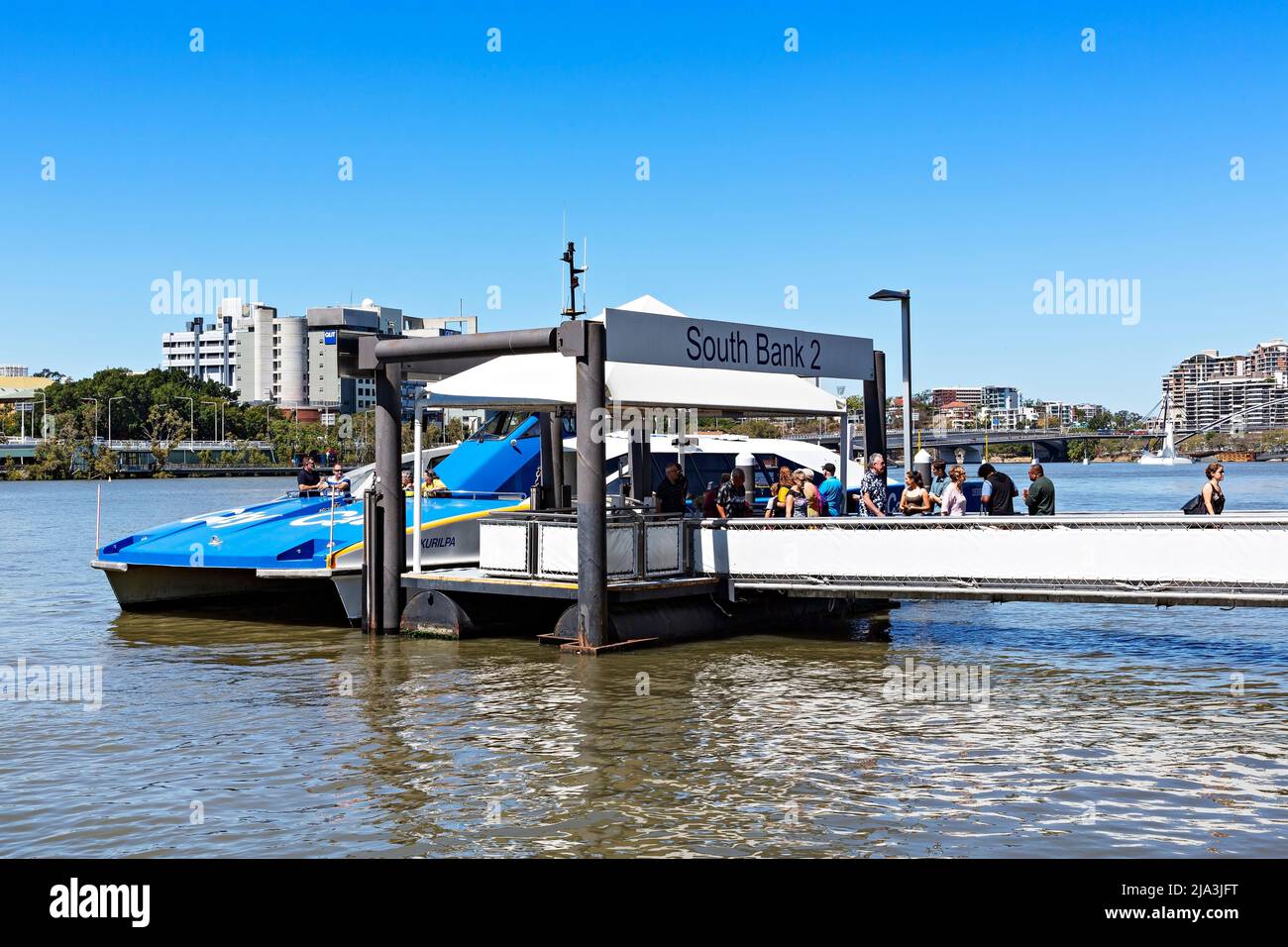 Brisbane Australia /  A fast City Cat Ferry carrying passengers, approaches South Bank 2 Ferry Wharf. Stock Photo