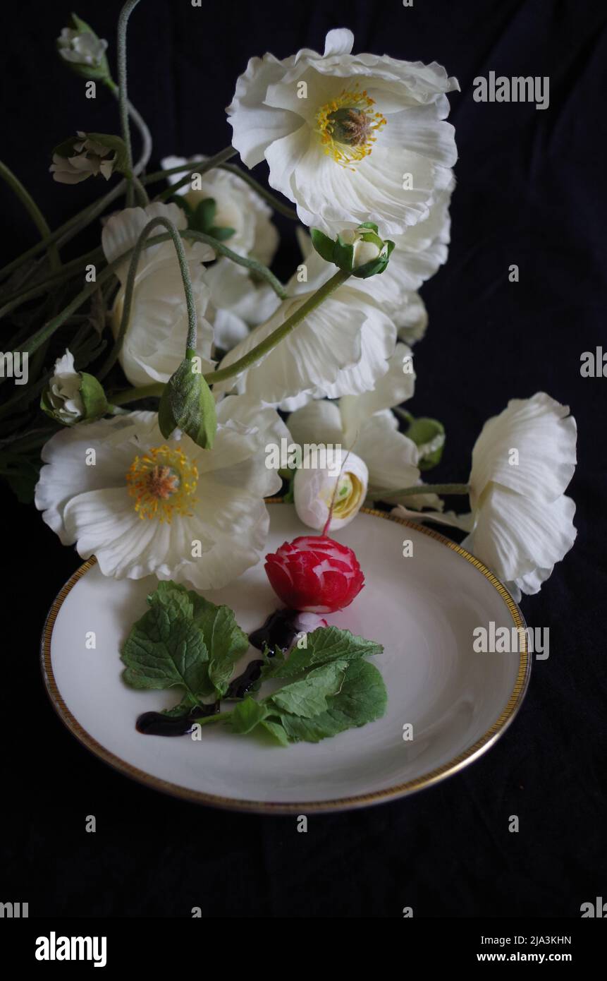 Red Radi on a Plate as Decoration. Apetizer. Stock Photo