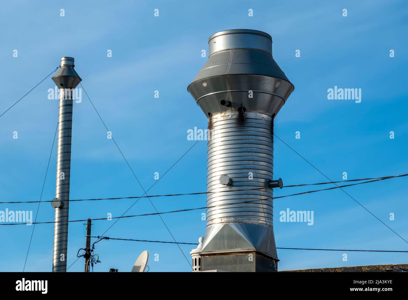 Business smoke extractor ventilation made of chrome and metal Stock