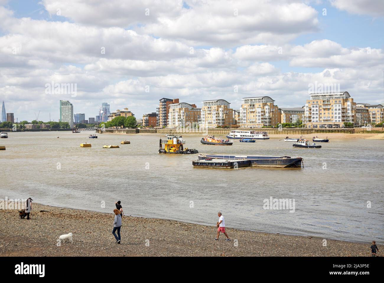 Isle of Dogs, London viewed from across the Thames at Greenwich at low tide, showing the beach. Stock Photo