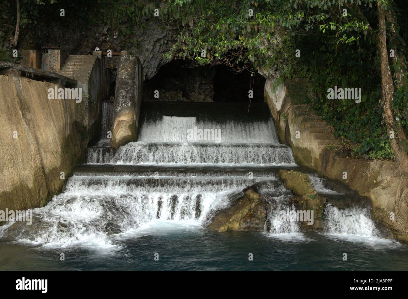 A waterfall and dam at limestone caves of Waikelo Sawah, a rare water source in Sumba—an island regularly hit by drought, which is located in Tema Tana village, East Wewewa, Southwest Sumba, East Nusa Tenggara, Indonesia. Stock Photo
