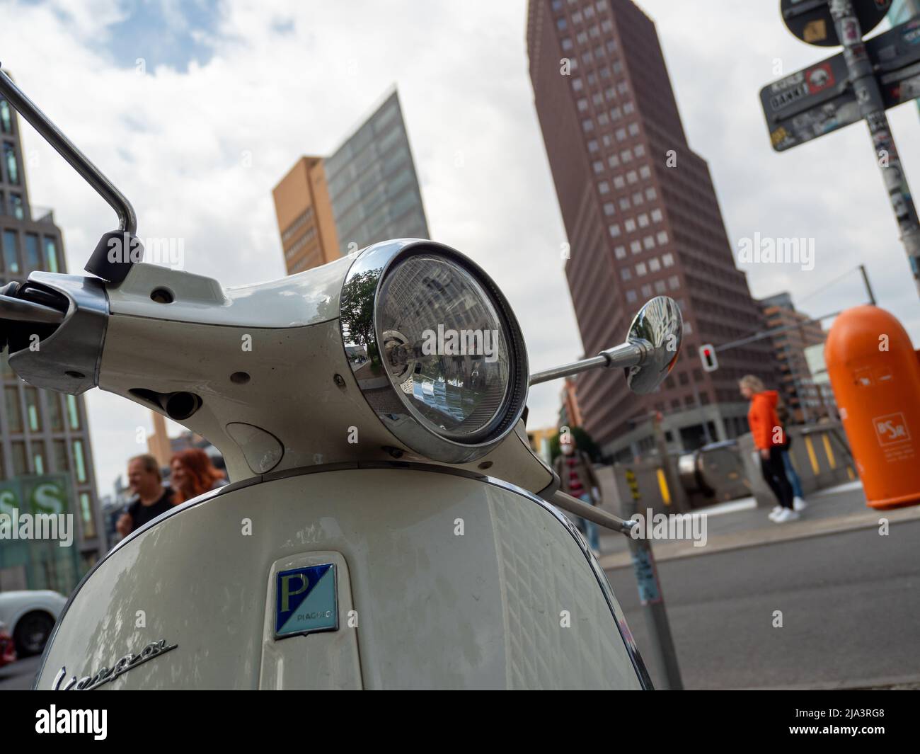 BERLIN, GERMANY - May 21, 2022; Scooter on the background of skyscrapers. Retro moped. Stock Photo