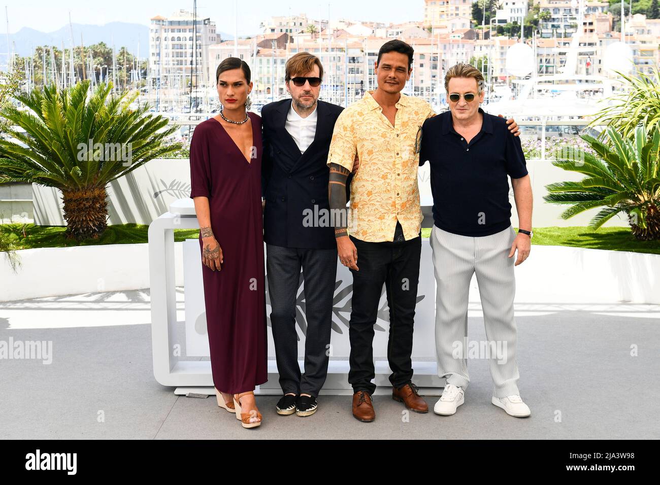 The 75th Cannes Film Festival - Photocall for the film 'Tourment sur les iles' (Pacifiction) in competition - Cannes, France, May 27, 2022. Director Albert Serra and cast members Benoit Magimel, Pahoa Mahagafanau and Matahi Pambrun pose. REUTERS/Piroschka Van De Wouw Stock Photo
