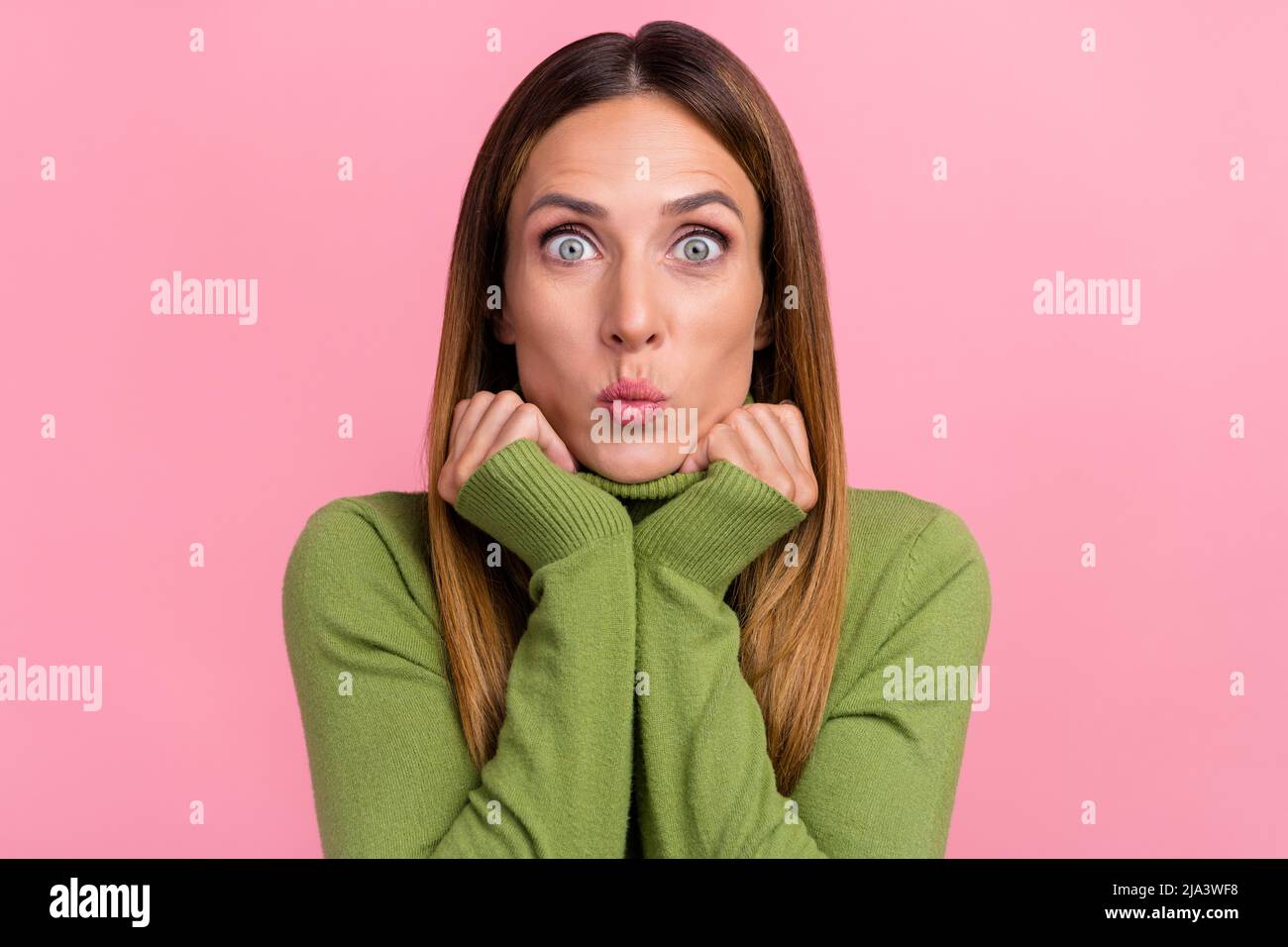Portrait of adorable sweet lady make ridiculous face joking lips pouted isolated on pastel color background Stock Photo