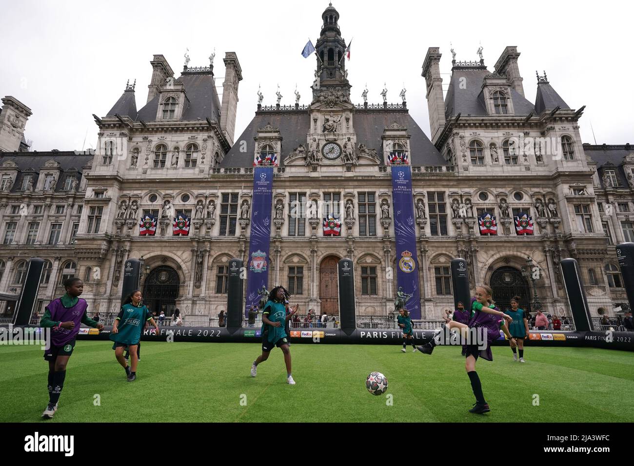 Young kids play on a mini pitch at the Trophy Expierence at The Place de l'Hotel de Ville in Paris ahead of Saturday's UEFA Champions League Final at the Stade de France, Paris. Picture date: Friday May 27, 2022. Stock Photo