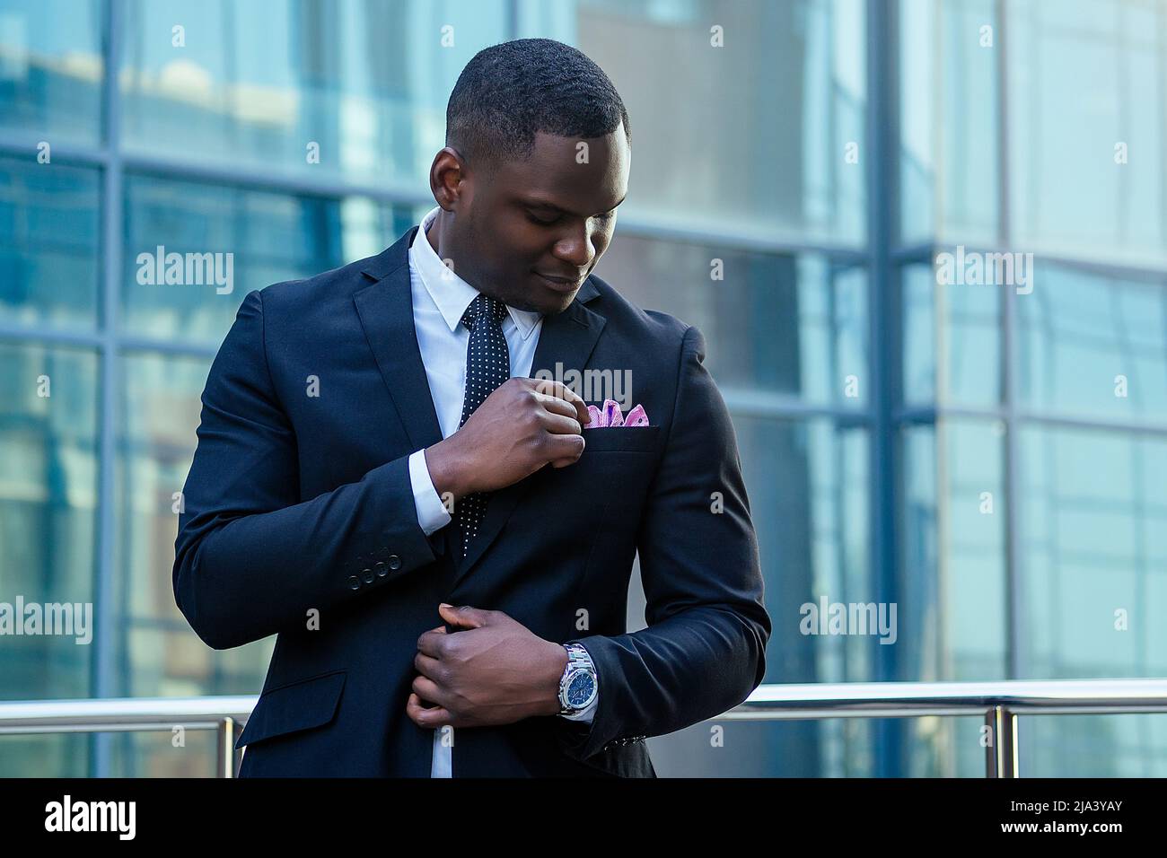 handsome and stylish African American model man in a fashionable black ...