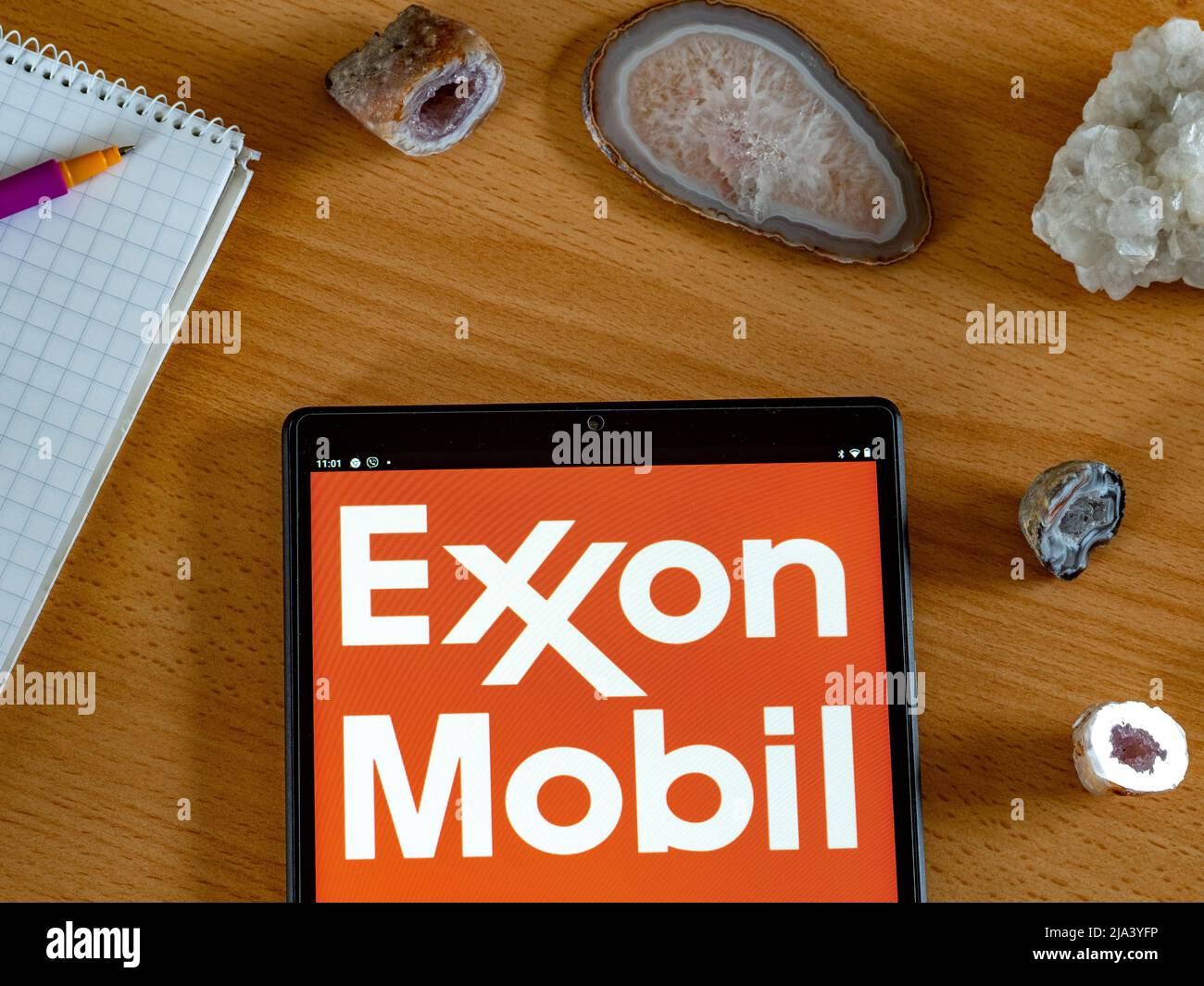 In this photo illustration Exxon Mobil Corporation logo seen displayed