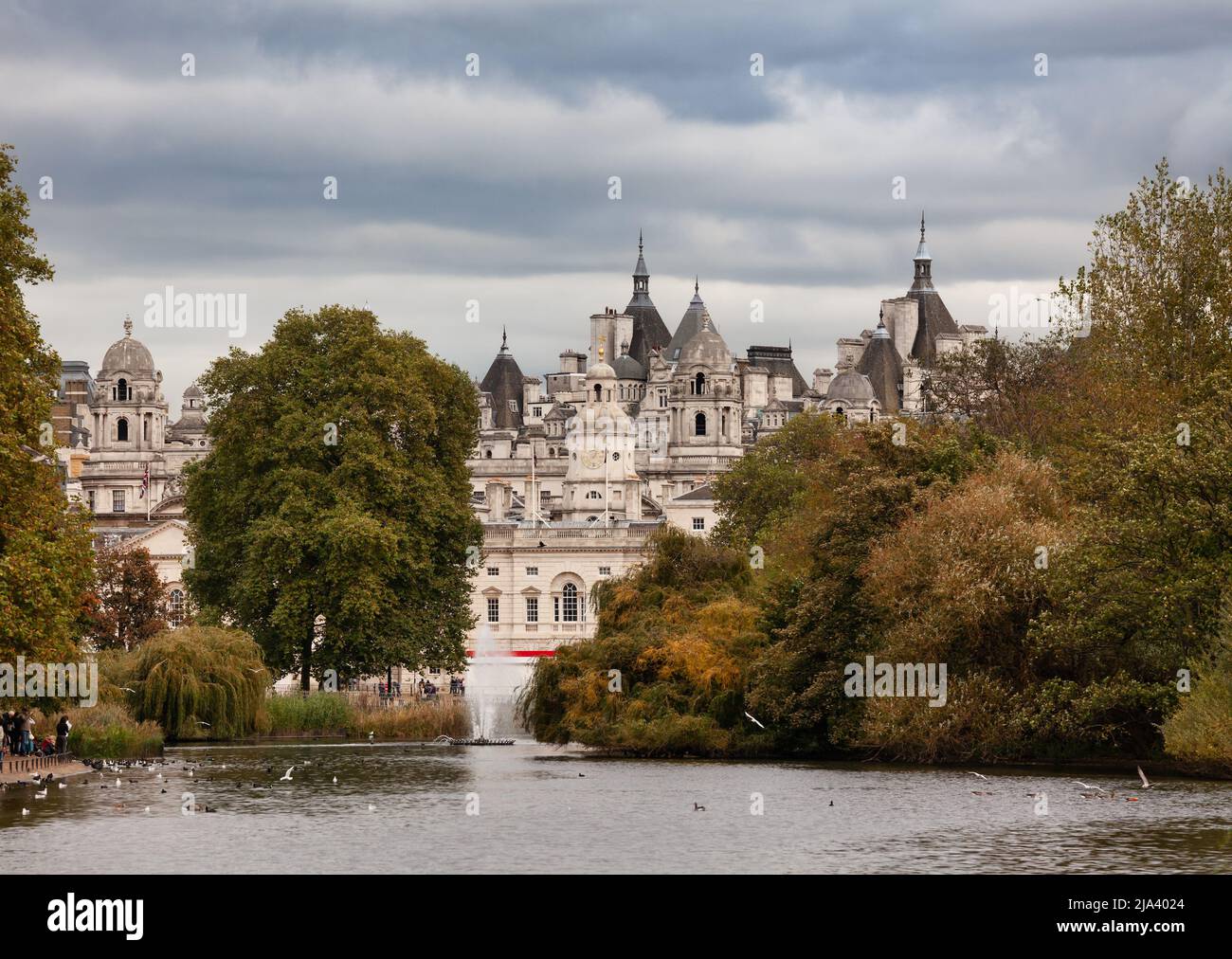 Autumn scene at St James's Park in Central London, UK. Horse Guards road buildings are seen in background Stock Photo