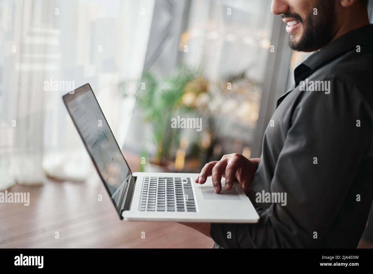 cropped image of a business man using a laptop. Stock Photo