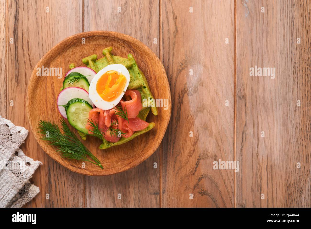Savory waffles. Breakfast green waffles wild garlic or spinach with egg