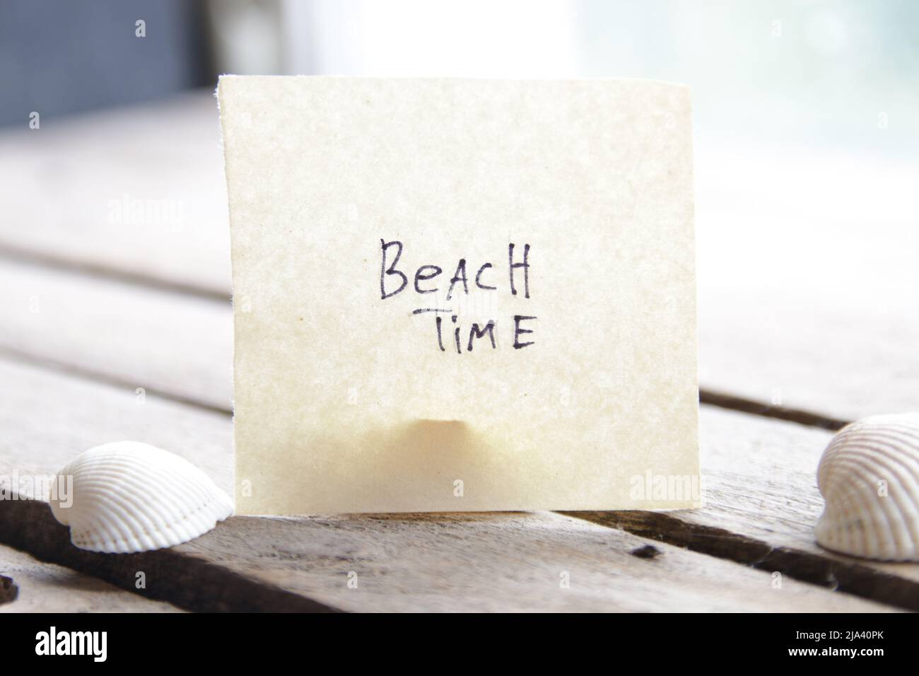 Beach time concept. Paper card with an inscription.  Stock Photo