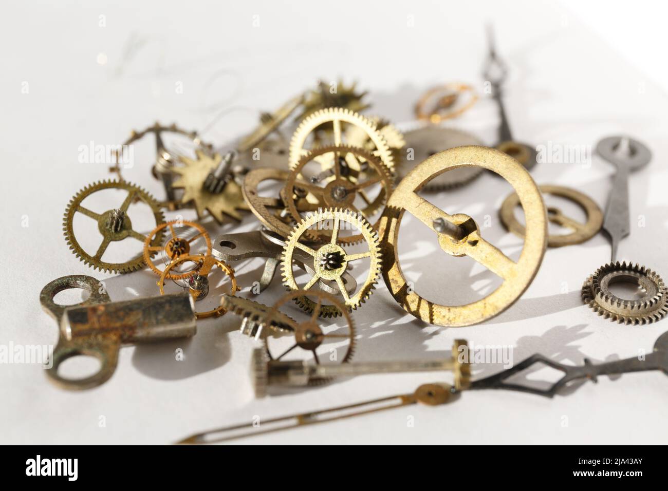 Turning cogwheels. Clock mechanism, gears, wheels, wristwatch parts close-up Stock Photo