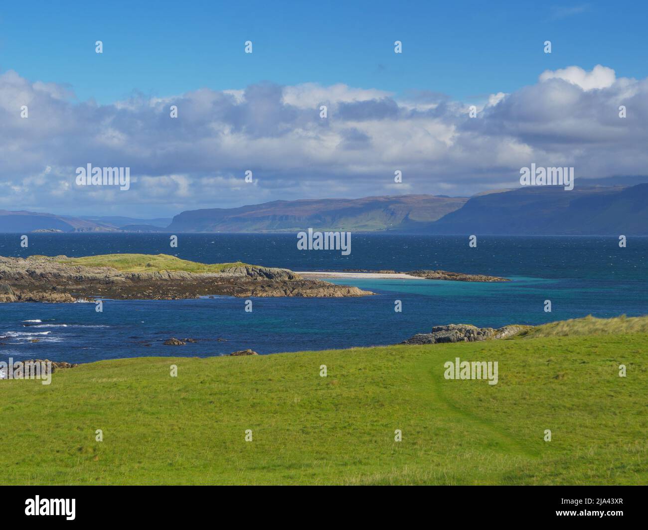 White Beach on Iona with the Isle of Mull in the distance, Highlands Scotland UK Stock Photo