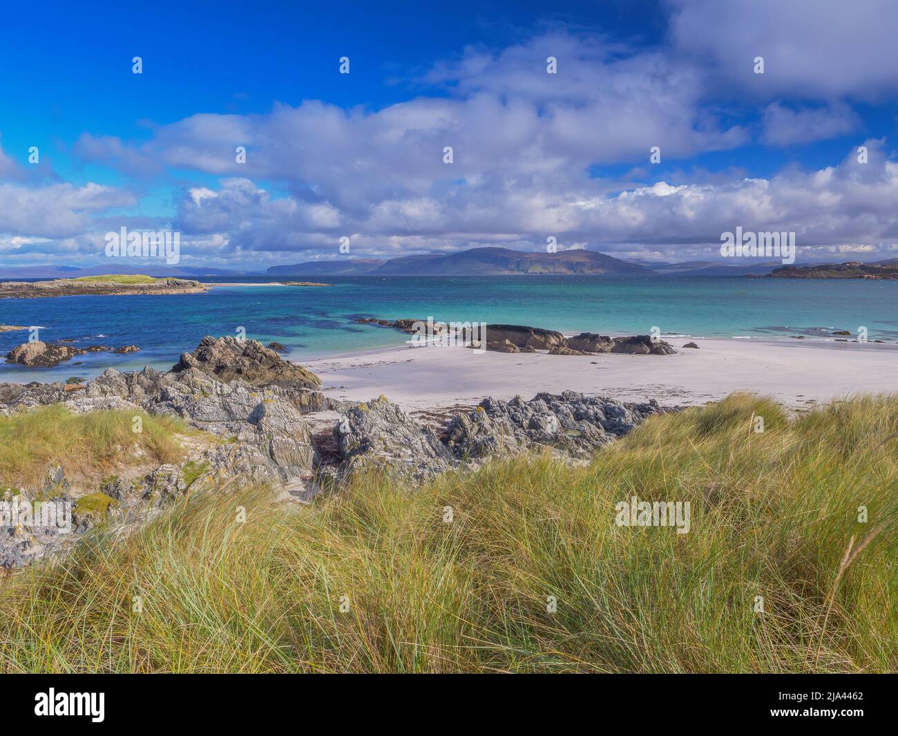 White Beach on Iona with the Isle of Mull in the distance, Highlands Scotland UK Stock Photo