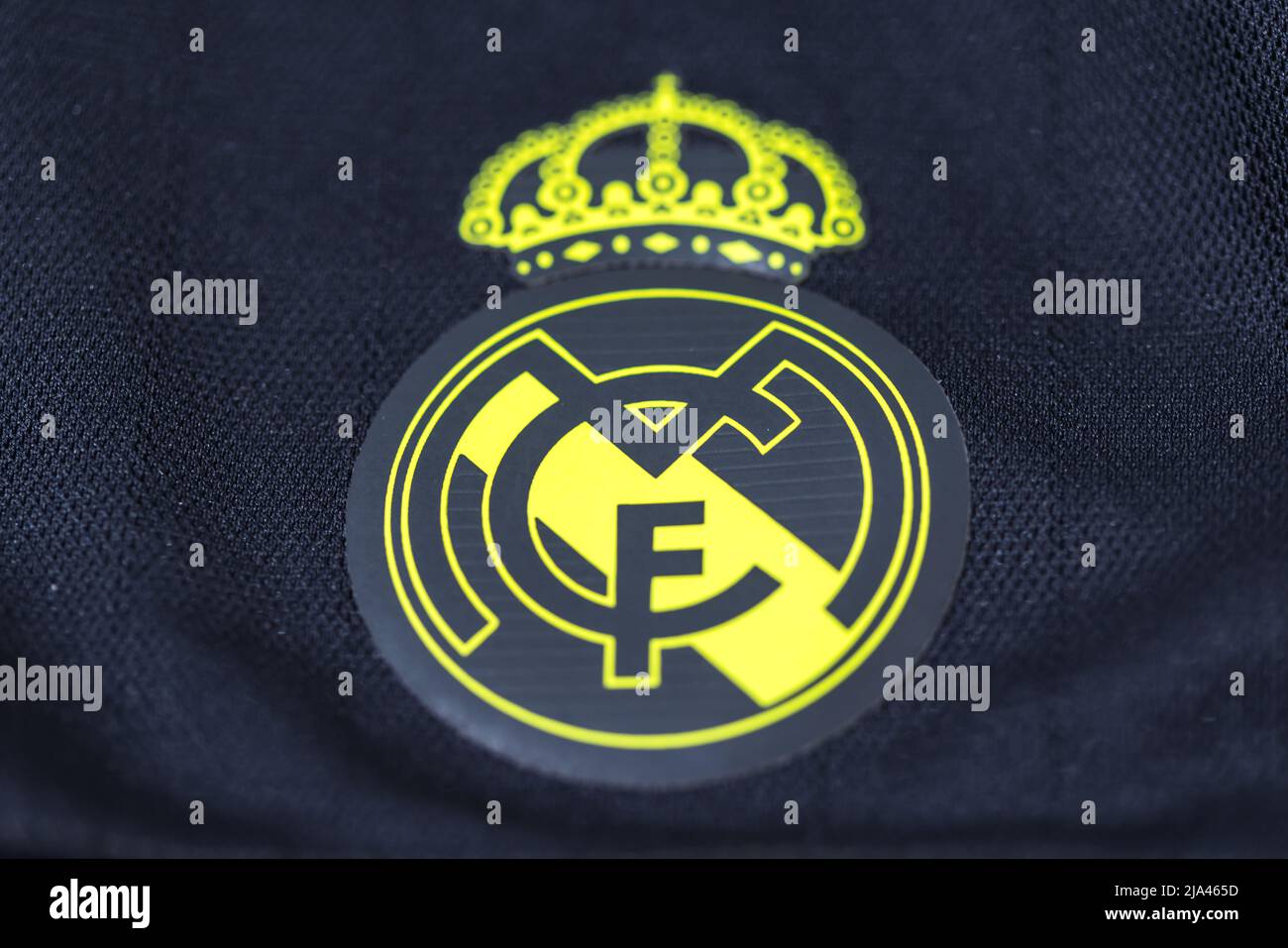 Yellow shield on the gray shirt of Real Madrid Football Club. Uefa champions league final concept on May 28, 2022, champion, europe, league, spain. Stock Photo