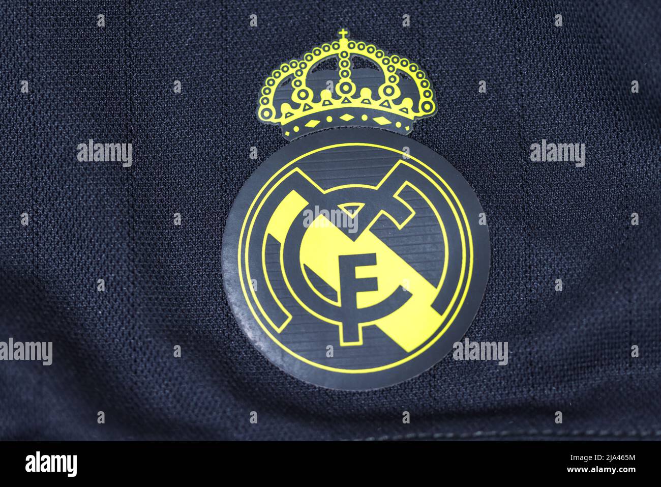 Yellow shield on the gray shirt of Real Madrid Football Club. Uefa champions league final concept on May 28, 2022, champion, europe, league, spain. Stock Photo