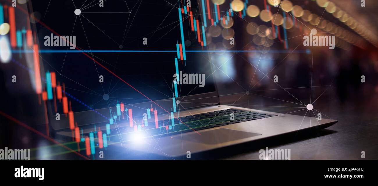 finance candles flow business chart on laptop. mixed media background Stock Photo