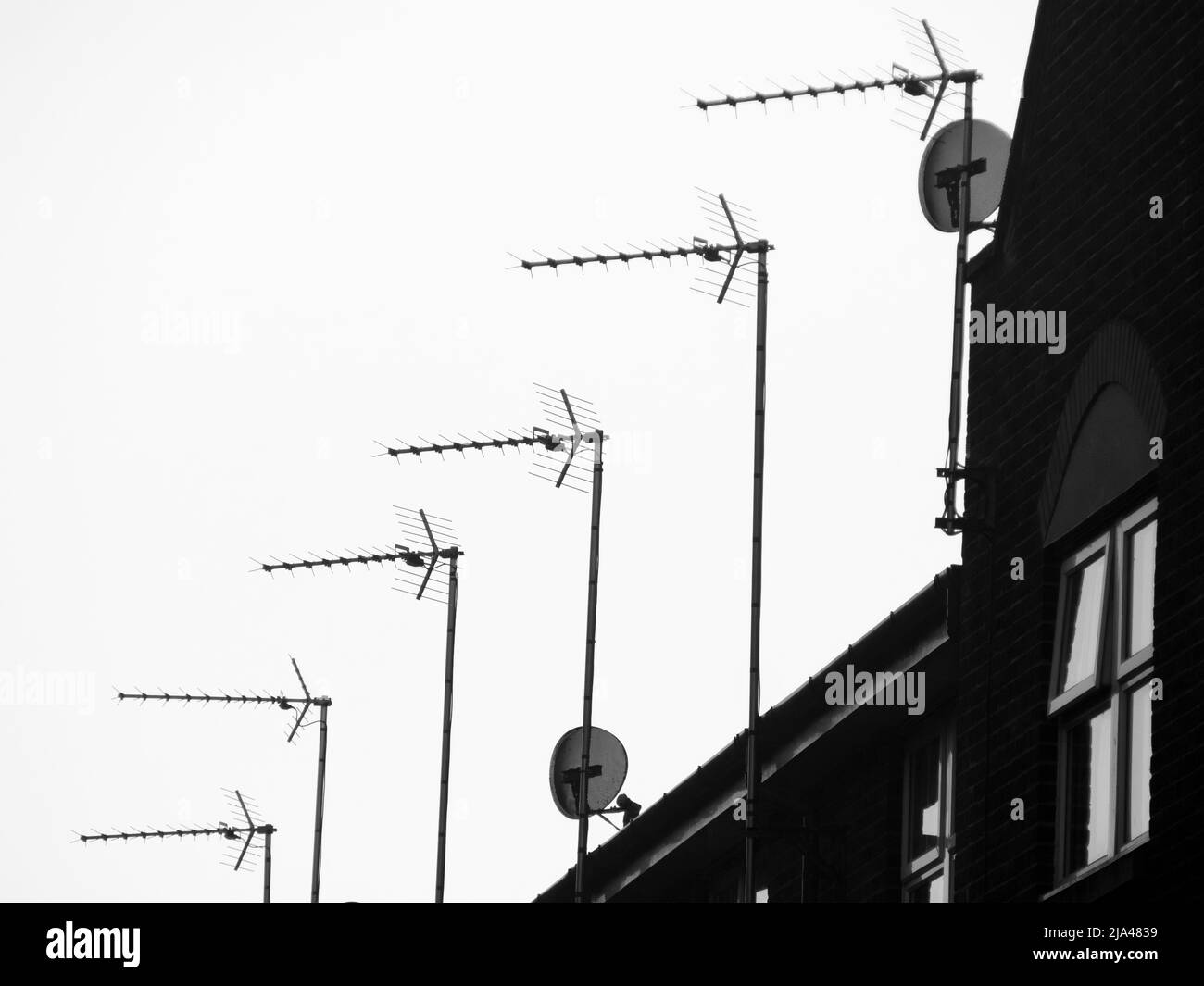 Old technologies. In an era when online streaming is increasingly dominating what and how we watch, both conventional satellite dishes and even more g Stock Photo
