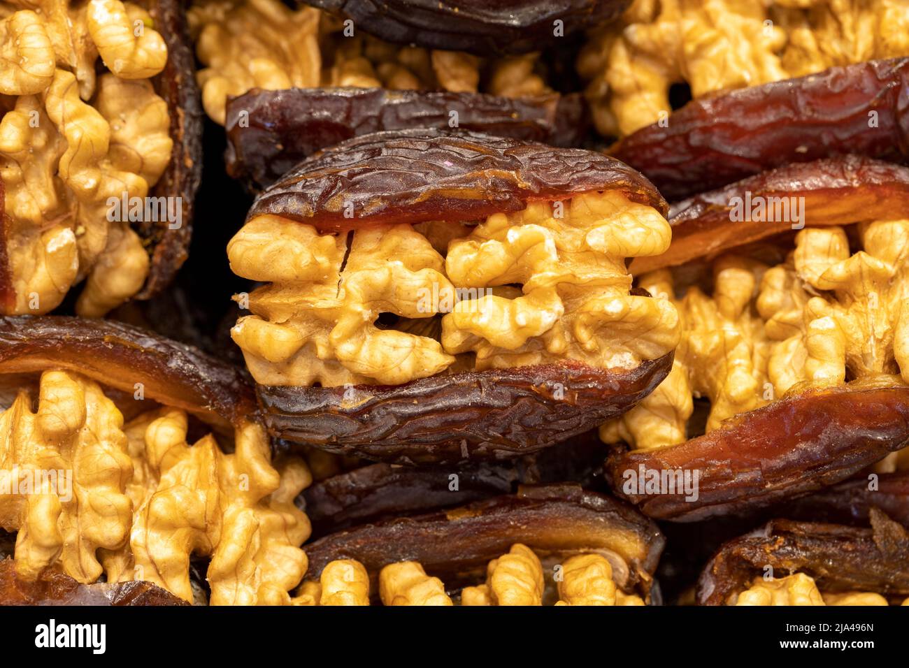 Walnut date fruit. Walnut filled dates healthy food. Closeup. local