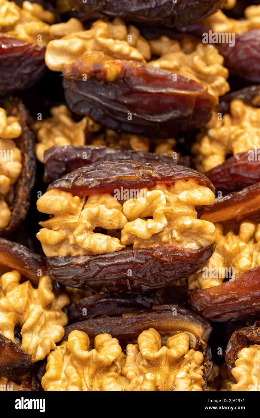 Walnut date fruit. Walnut filled dates healthy food. Closeup. local