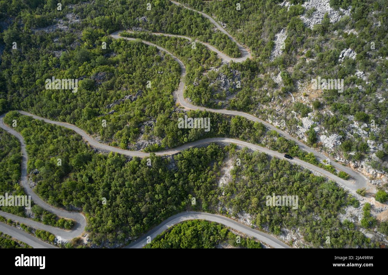 Drone view of a mountain serpentine road in Montenegro. Stock Photo