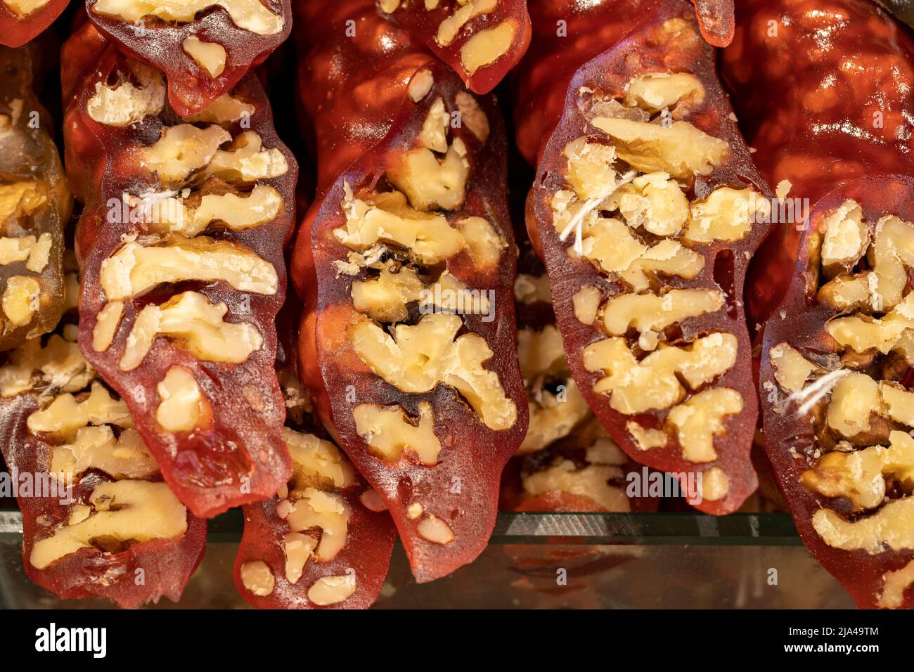 Pomegranate walnut sausage. Sweet snack. Close-up. local name cevizli sucuk Stock Photo