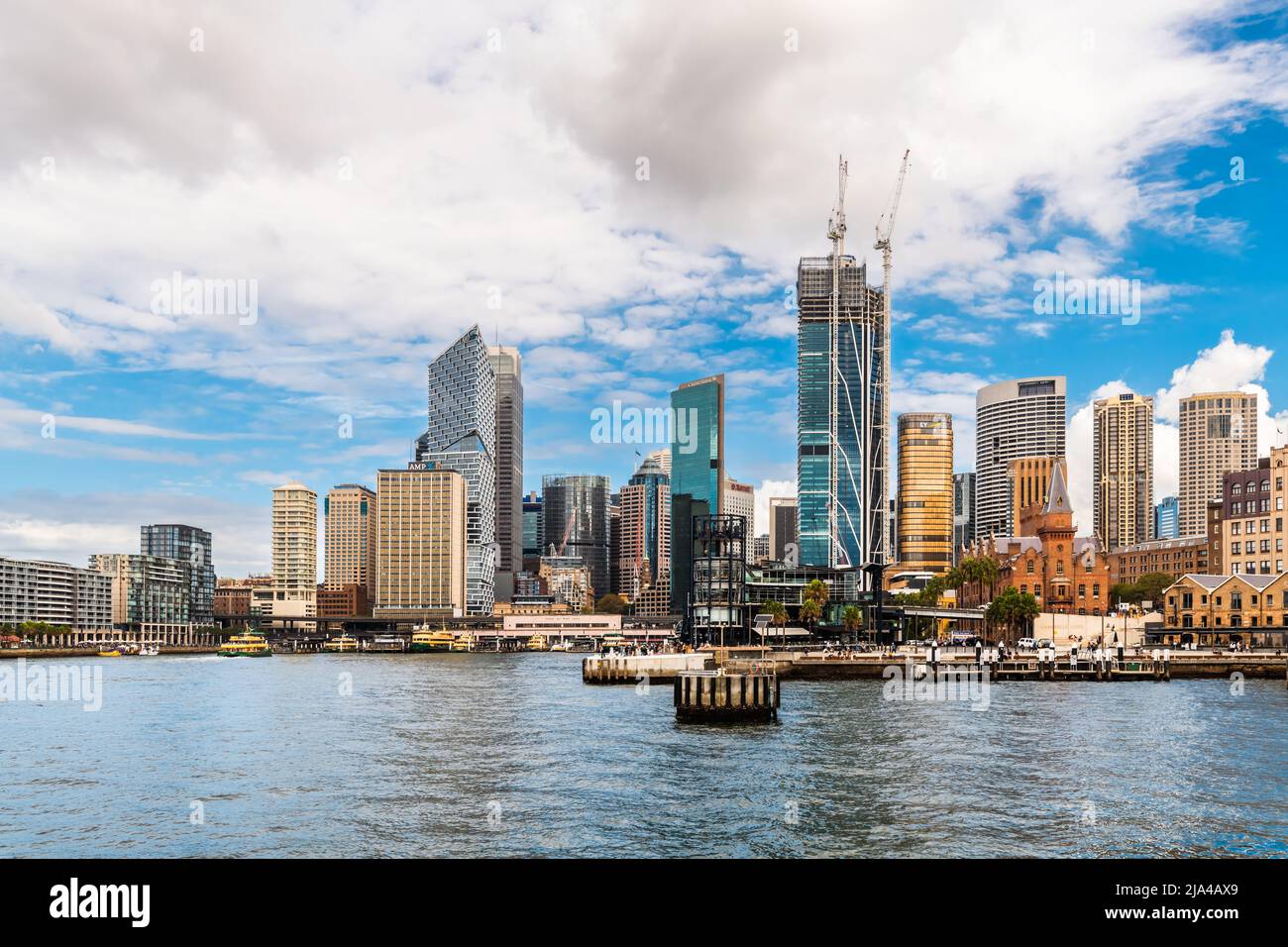 Sydney City, Australia - April 16, 2022: Sydney central business district and Circular Quay viewed through Campbells Cove from Hickson Road Reserve on Stock Photo