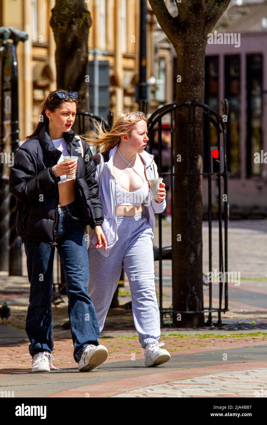 Dundee, Tayside, Scotland, UK. 27th May, 2022. UK Weather. Temperatures in parts of North East Scotland reached 17°C due to blustery conditions and warm sunshine. Despite the strong winds and sunny periods during the day, only a few fashionable Dundee women are out and about in the city centre, spending the day shopping and socializing while enjoying the warm late Spring weather. Credit: Dundee Photographics/Alamy Live News Stock Photo