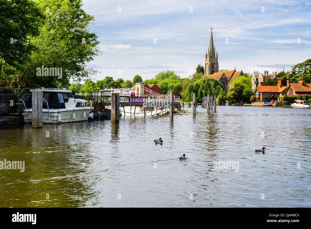 View from Marlow lock along River Thames to weir and All Saints Church in the town of Marlow, Buckinghamshire, England, UK, Britain Stock Photo